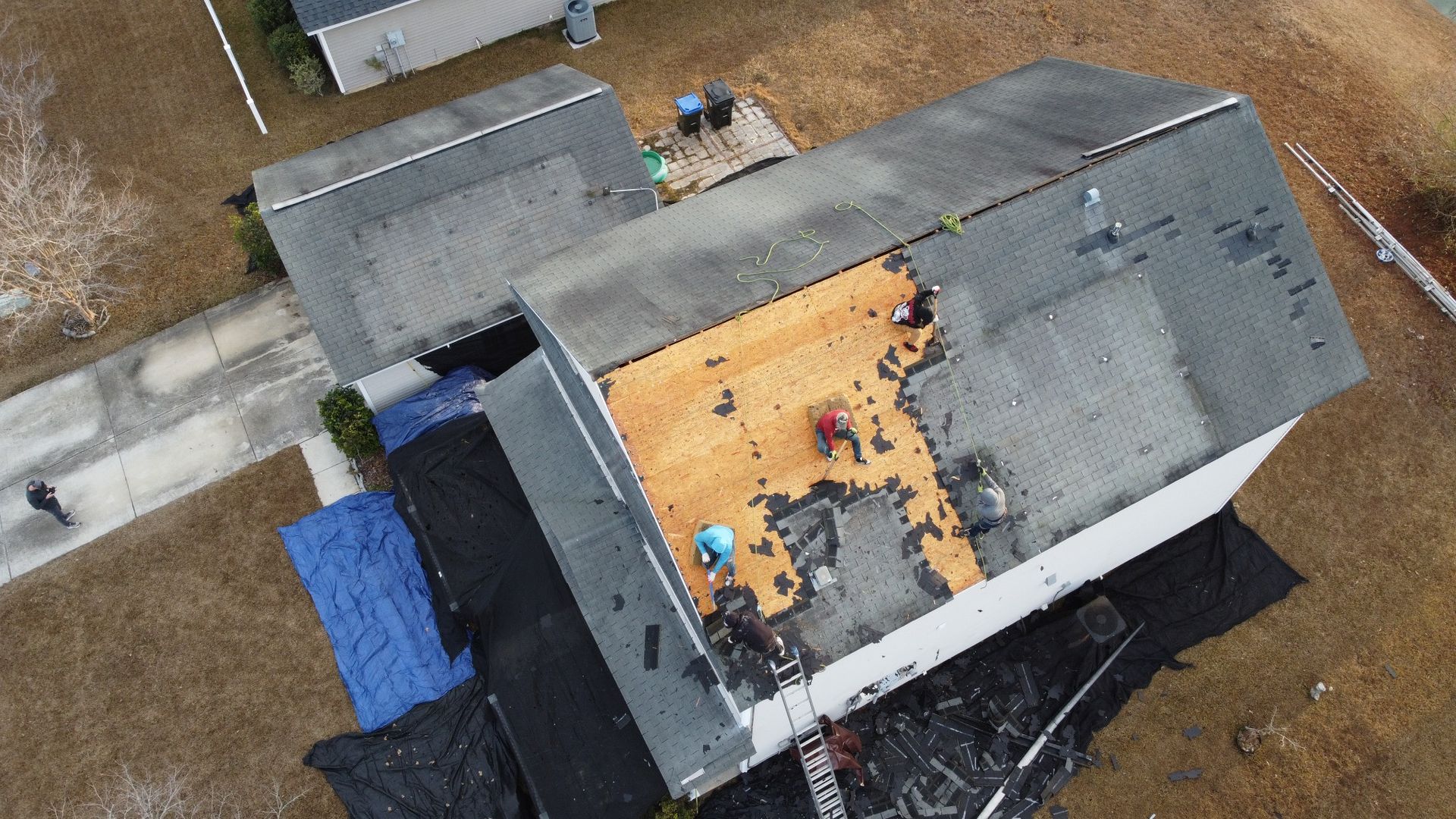Exposed roof decking during tear-off with solar panels removed