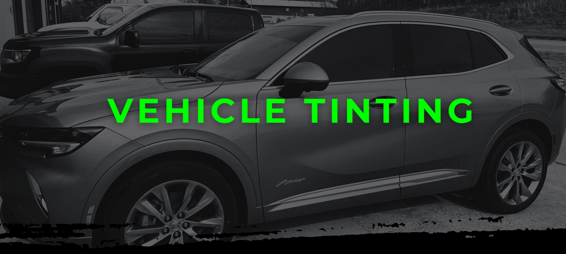 Gray SUV with neon green text reading “VEHICLE TINTING” overlaid on the side view