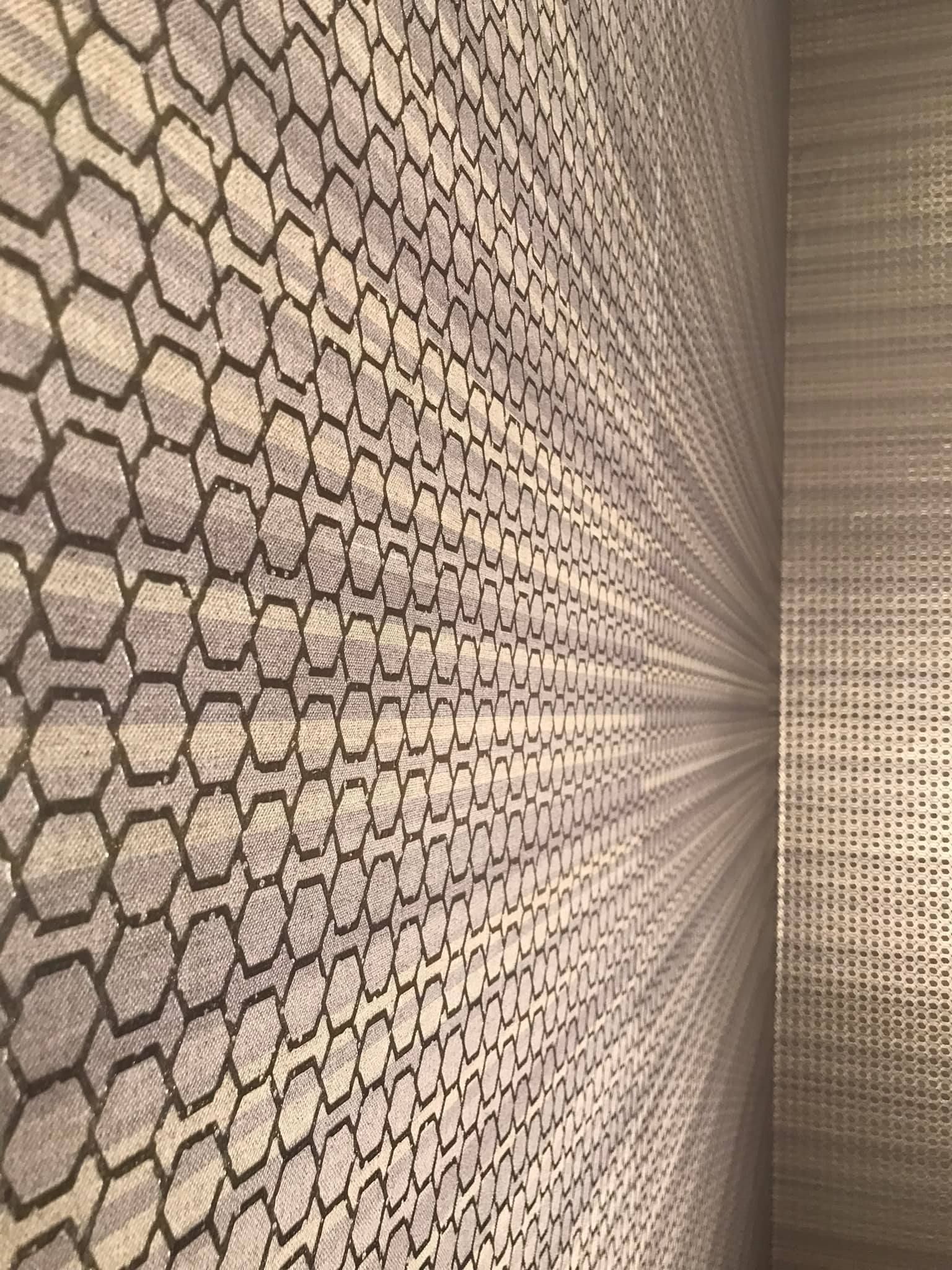 A close up of a wall with a pattern on it.