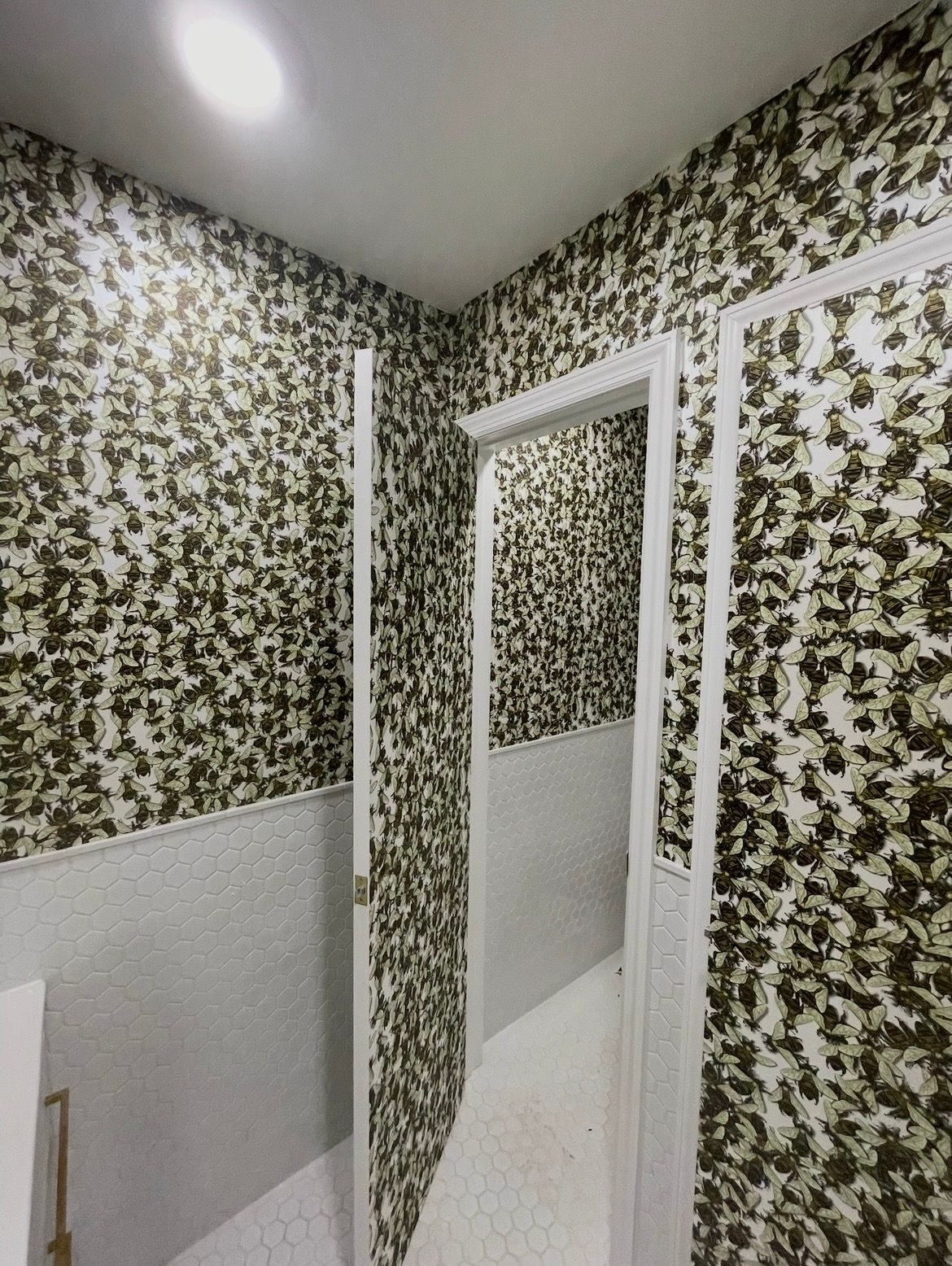 A room with a window and a bunch of pipes on the floor