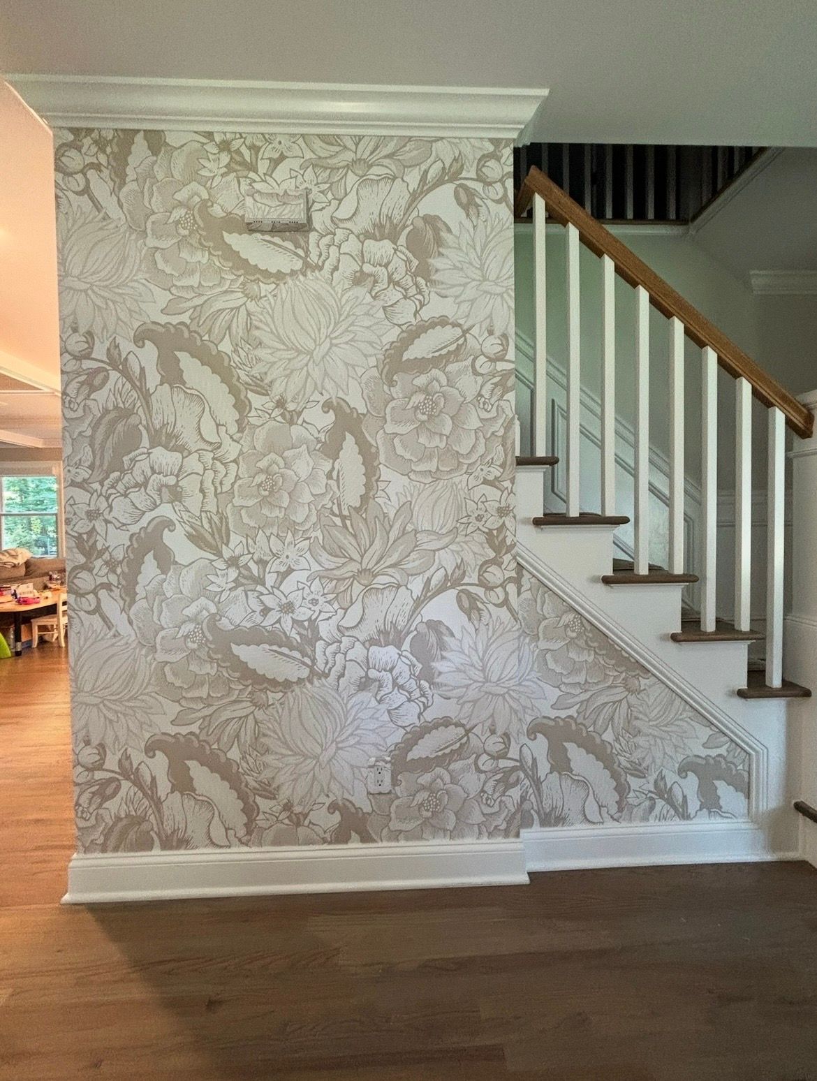 A room with a window and a green line on the wall.