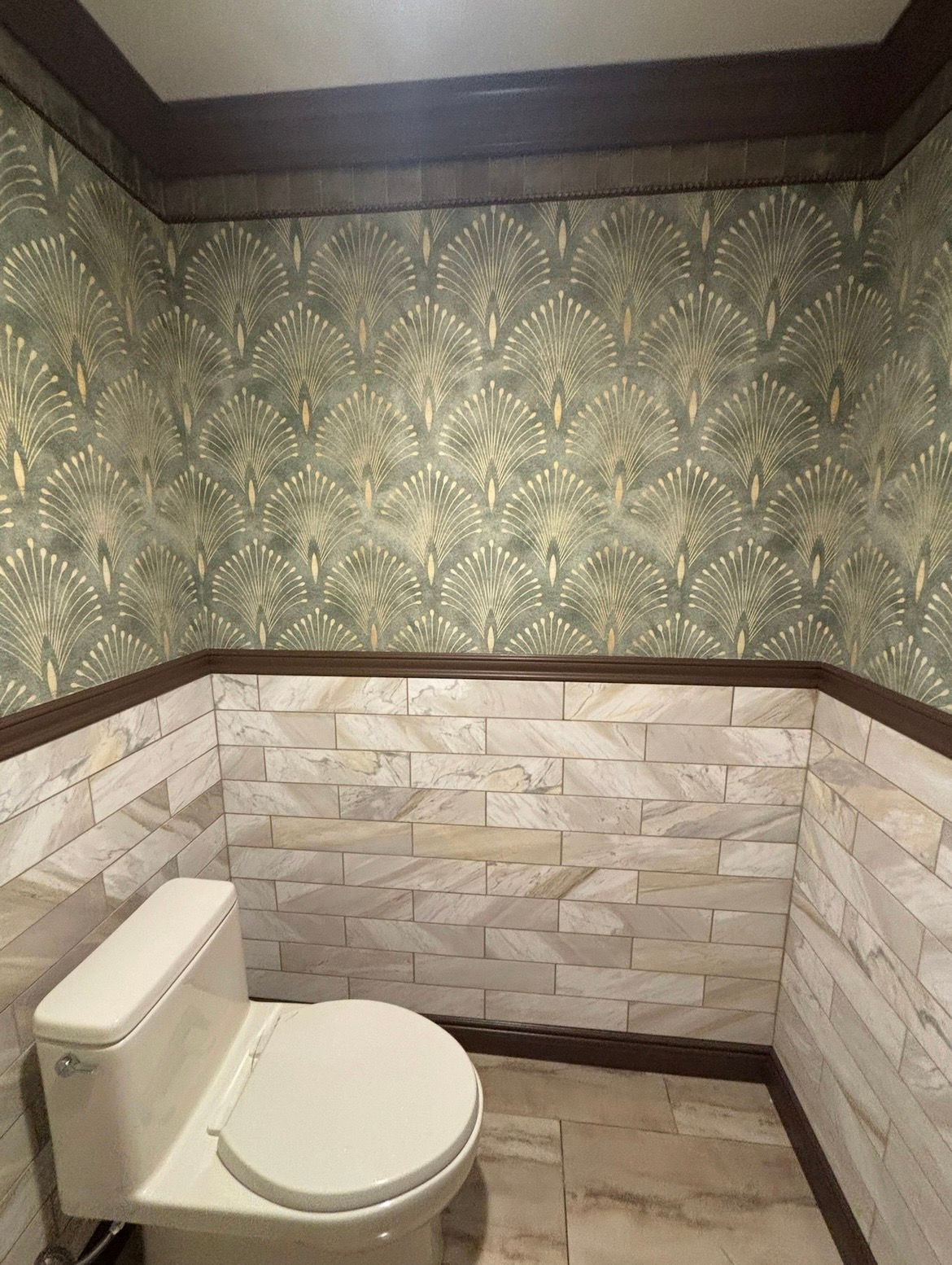 A room with a ceiling that is being painted and a wall that is being painted.