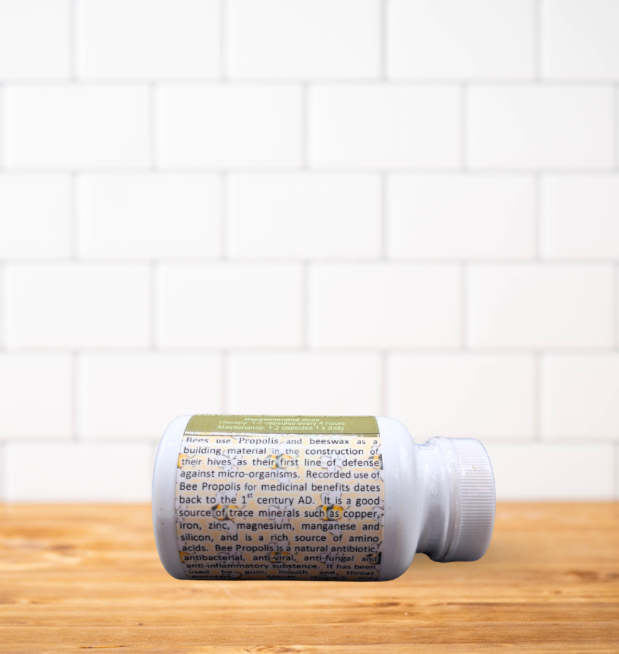 A bottle of pills is sitting on a wooden table.