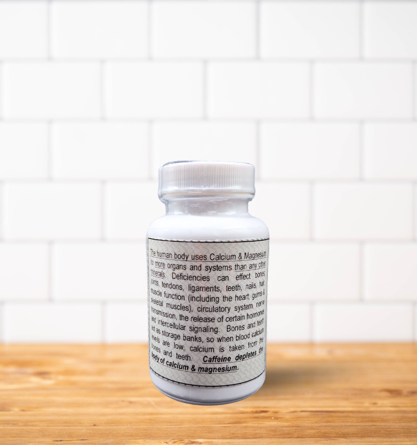 A bottle of pills is sitting on a wooden table.