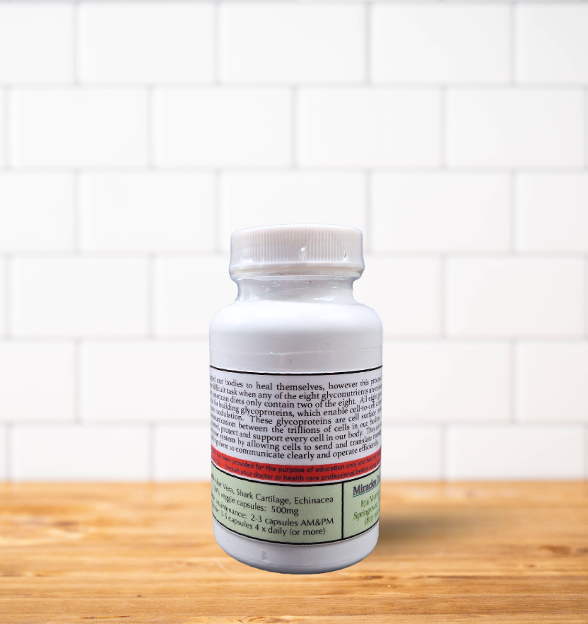 A bottle of pills is sitting on a wooden table.