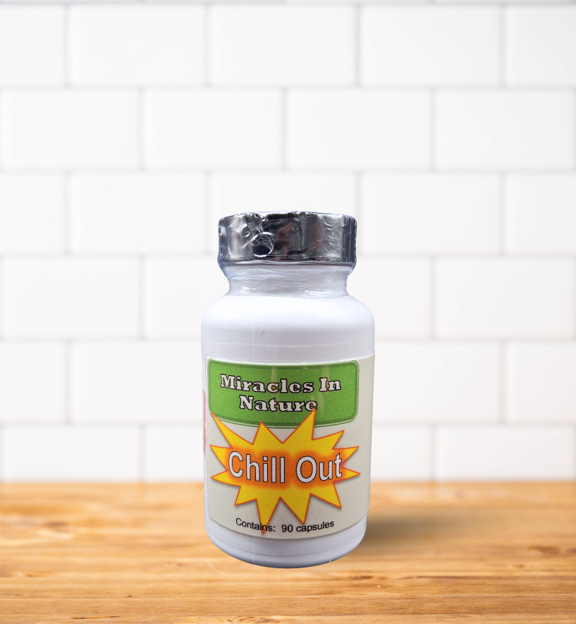 A bottle of chill out pills is sitting on a wooden table.