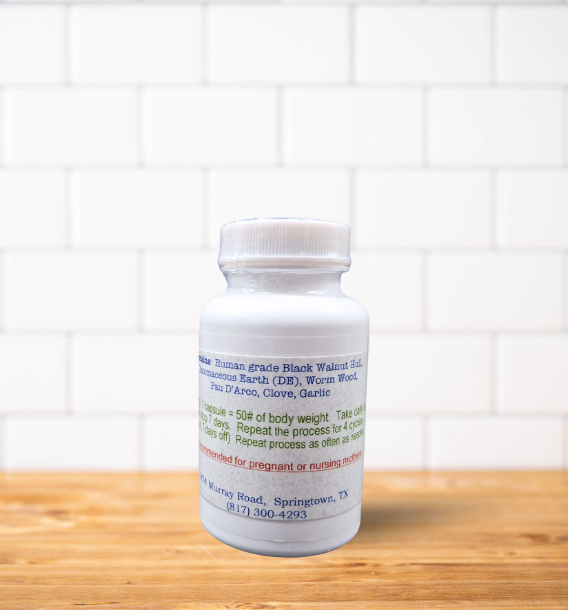A bottle of pills is sitting on a wooden table.