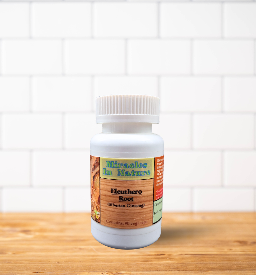 A bottle of miracles of nature beuthera root is sitting on a wooden table.