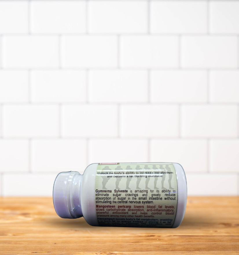 A bottle of pills is sitting on a wooden table in front of a white brick wall.