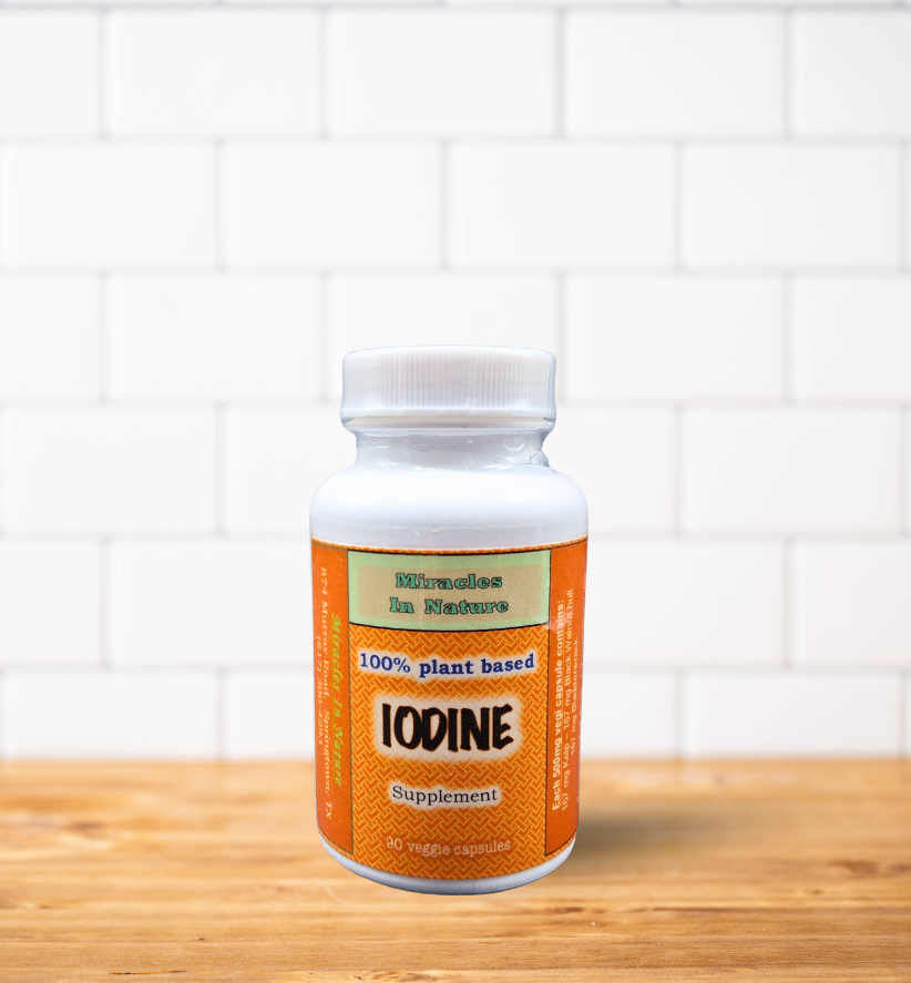 A bottle of endocrine system support is sitting on a wooden table.