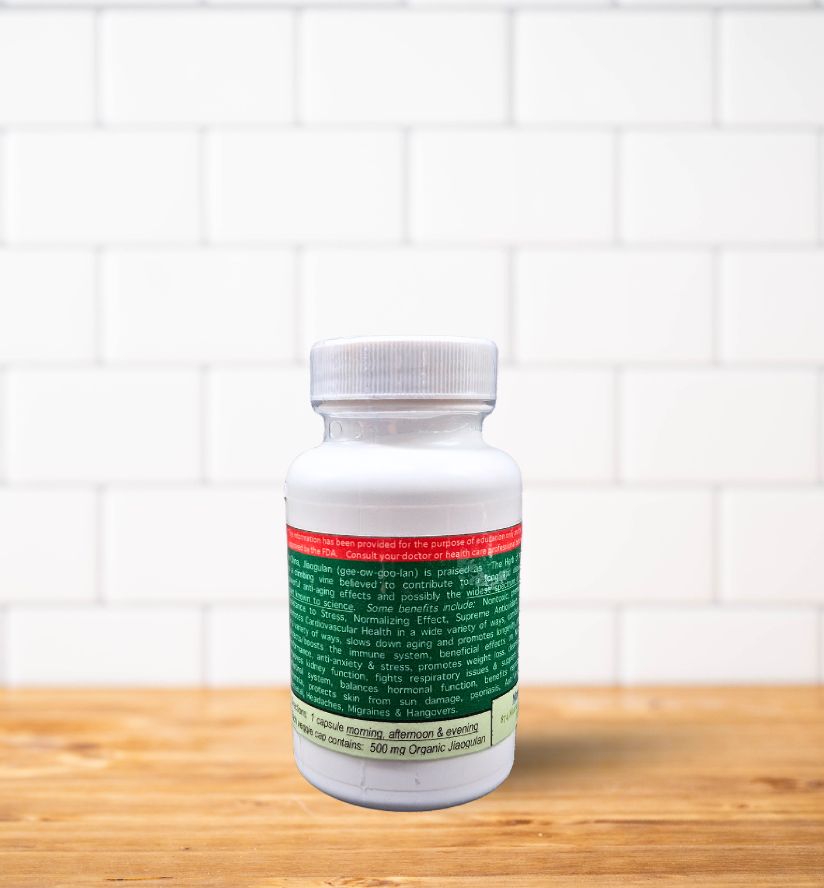 A bottle of pills is sitting on a wooden table.