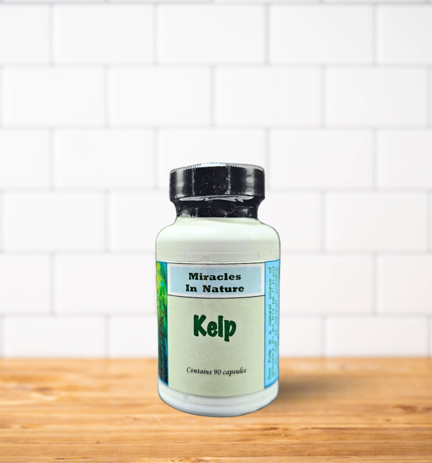 A bottle of kelp capsules is sitting on a wooden table.