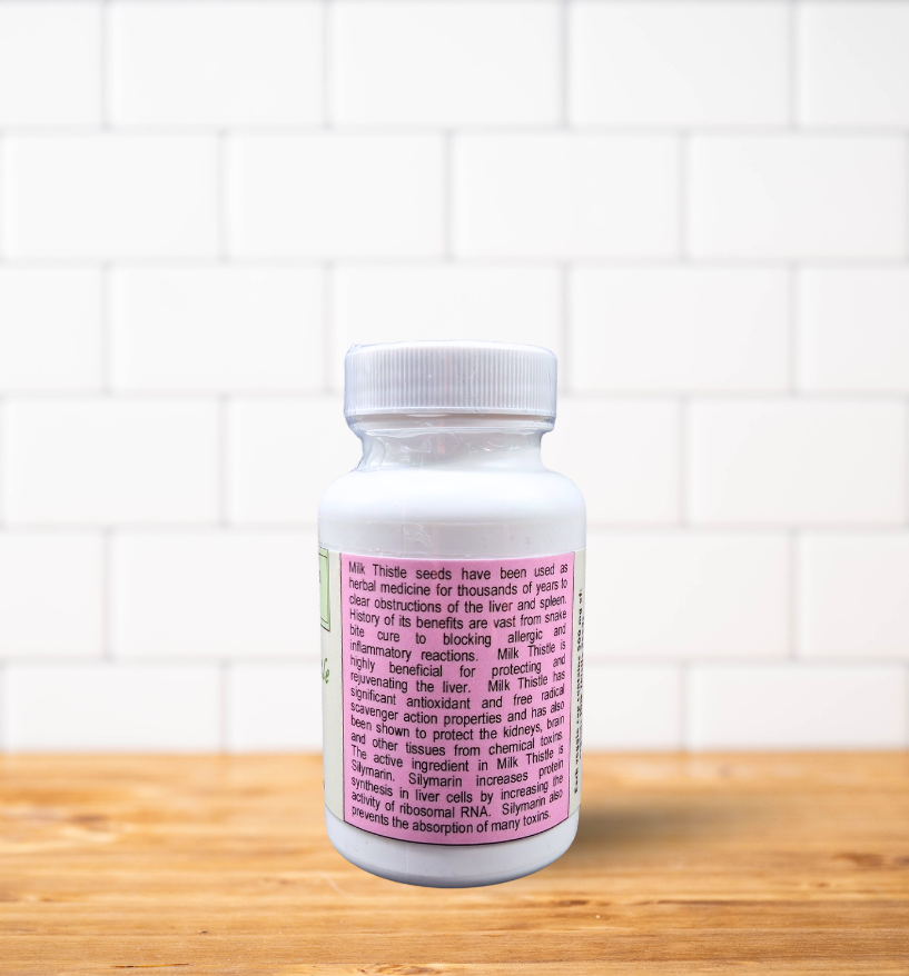A white bottle of pills is sitting on a wooden table.