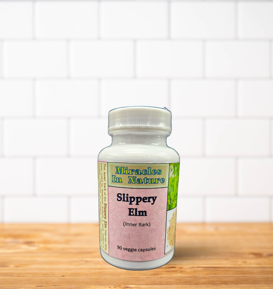 A bottle of slippery elm is sitting on a wooden table.