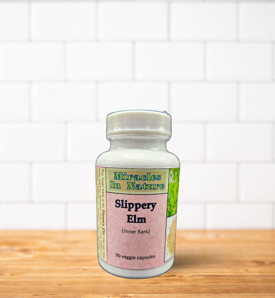 A bottle of slippery elm is sitting on a wooden table.