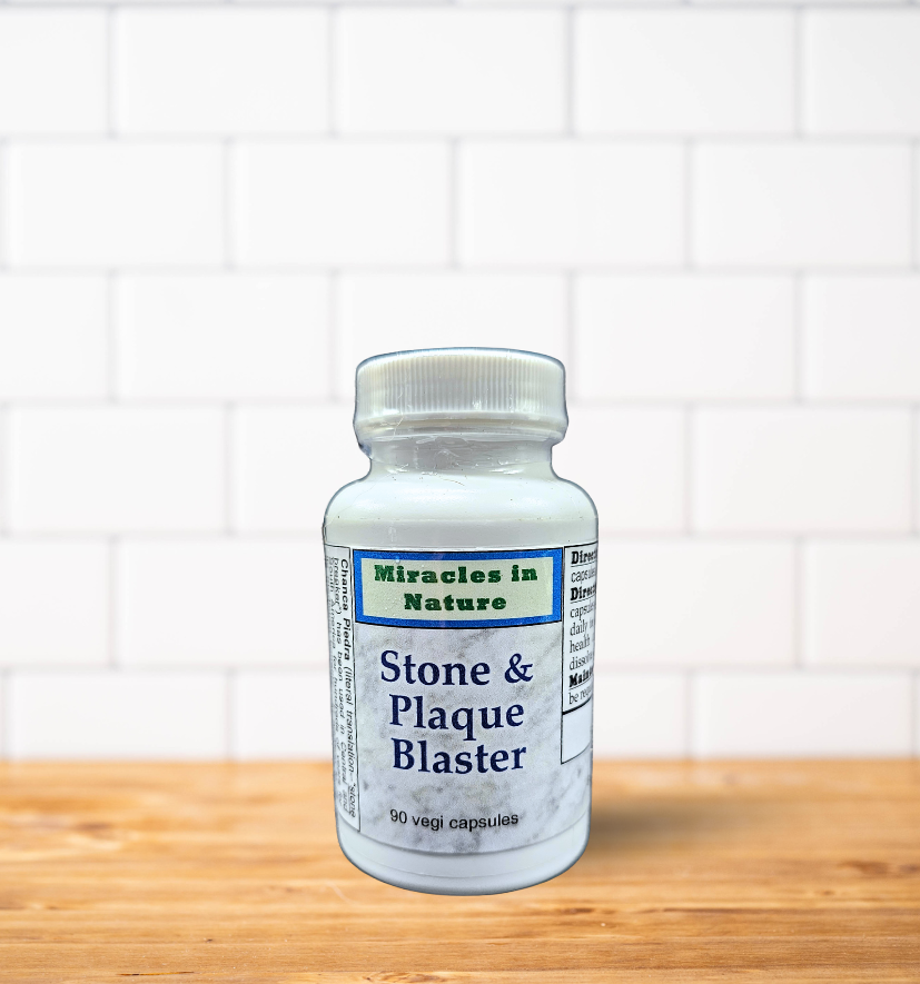 A bottle of stone and plaque blaster is sitting on a wooden table.
