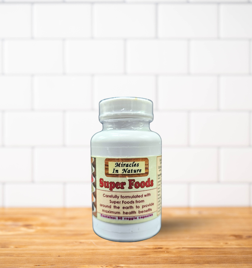 A bottle of miracles in nature women 's health is sitting on a wooden table.