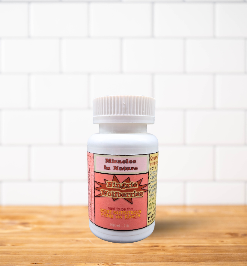 A bottle of pills is sitting on a wooden table.