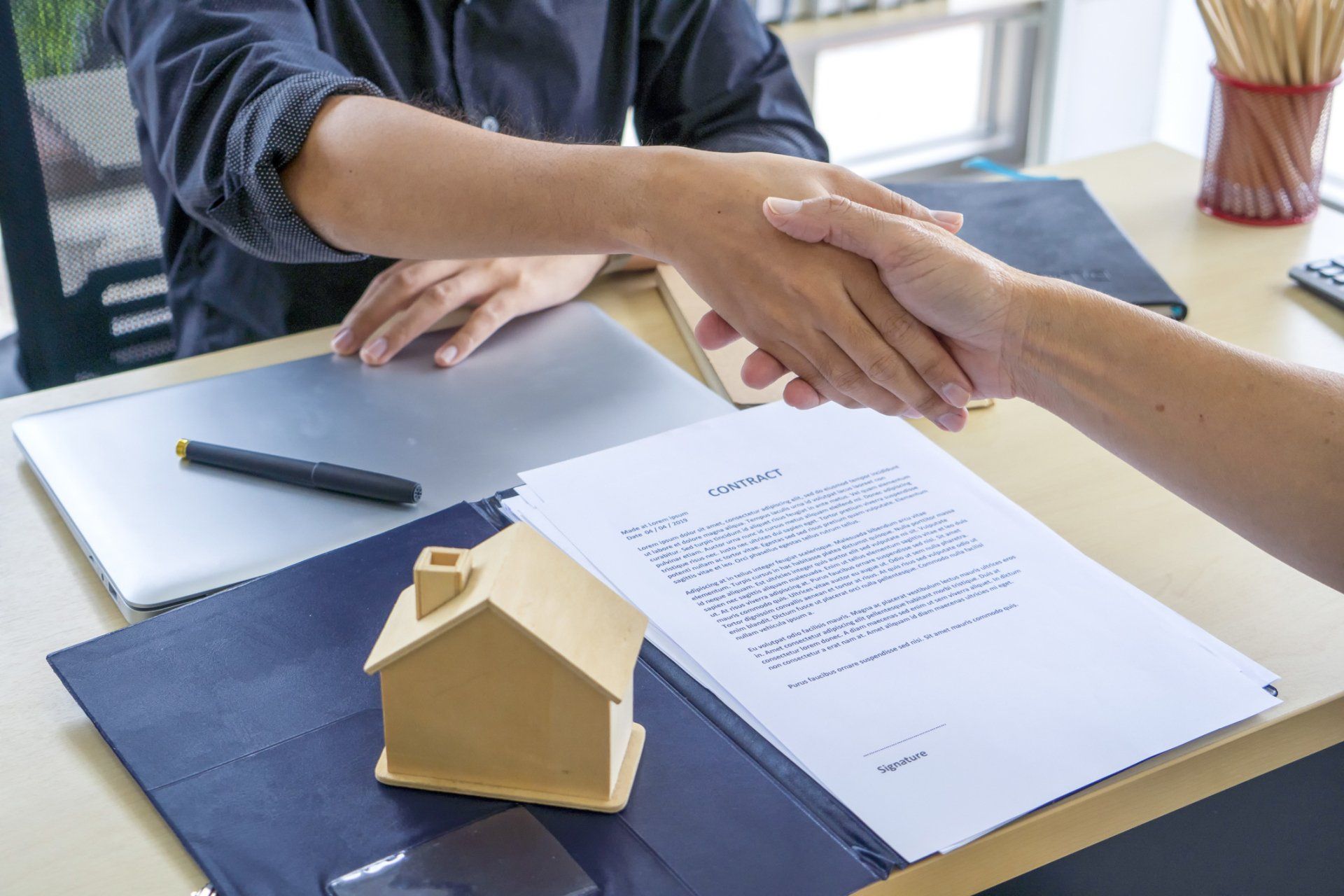 Real State Agent Shaking Hands with the Client - Mount Ayr, IA - Abstract & Title Co. of Ringgold County Real State Agent Shaking Hands with the Client - Mount Ayr, IA - Abstract & Title Co. of Ringgold County