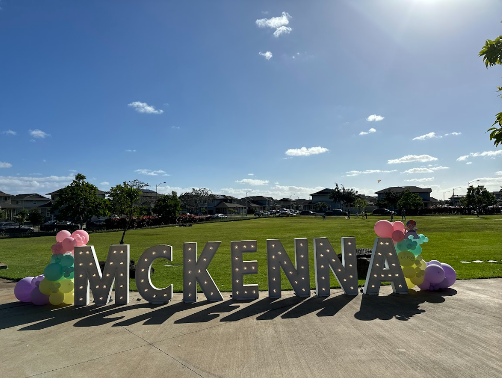 The name mckenna is written in large letters in a park.