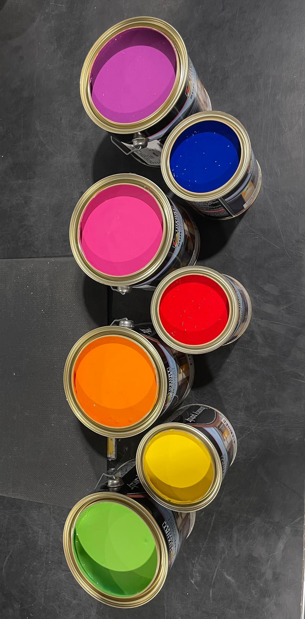Five Open Paint Cans Showing Purple, Blue, Pink, Red, Orange, Yellow, and Green Paint — Paint Place Cowra in Bathurst, NSW