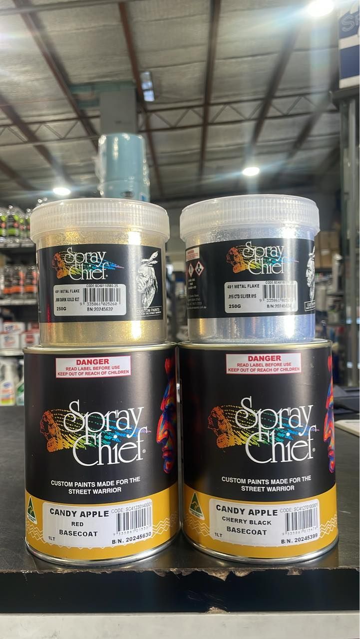 Stacked Cans of Spray & Chick Paint in a Warehouse Aisle — Paint Place Cowra in Bathurst, NSW