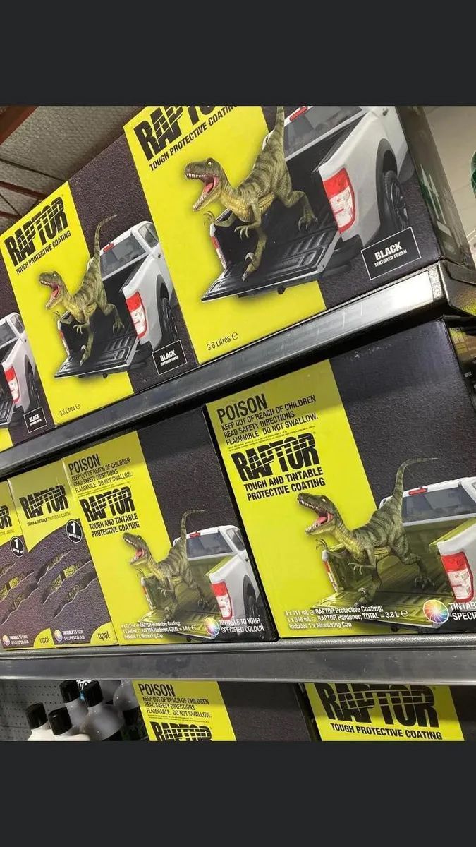 Yellow “RAPTOR” Action Figure Boxes Displayed on Store Shelves — Paint Place Cowra in Orange, NSW