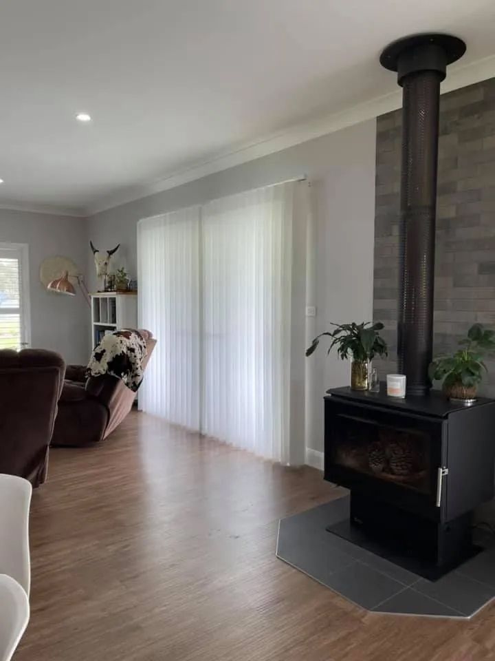 Bright Living Room With Wood Floors, White Curtains — Paint Place Cowra in Cowra, NSW
