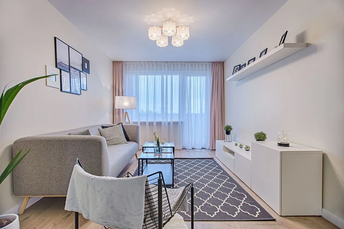 Bright Modern Living Room With Grey Sofa, Patterned Rug — Paint Place Cowra in Cowra, NSW