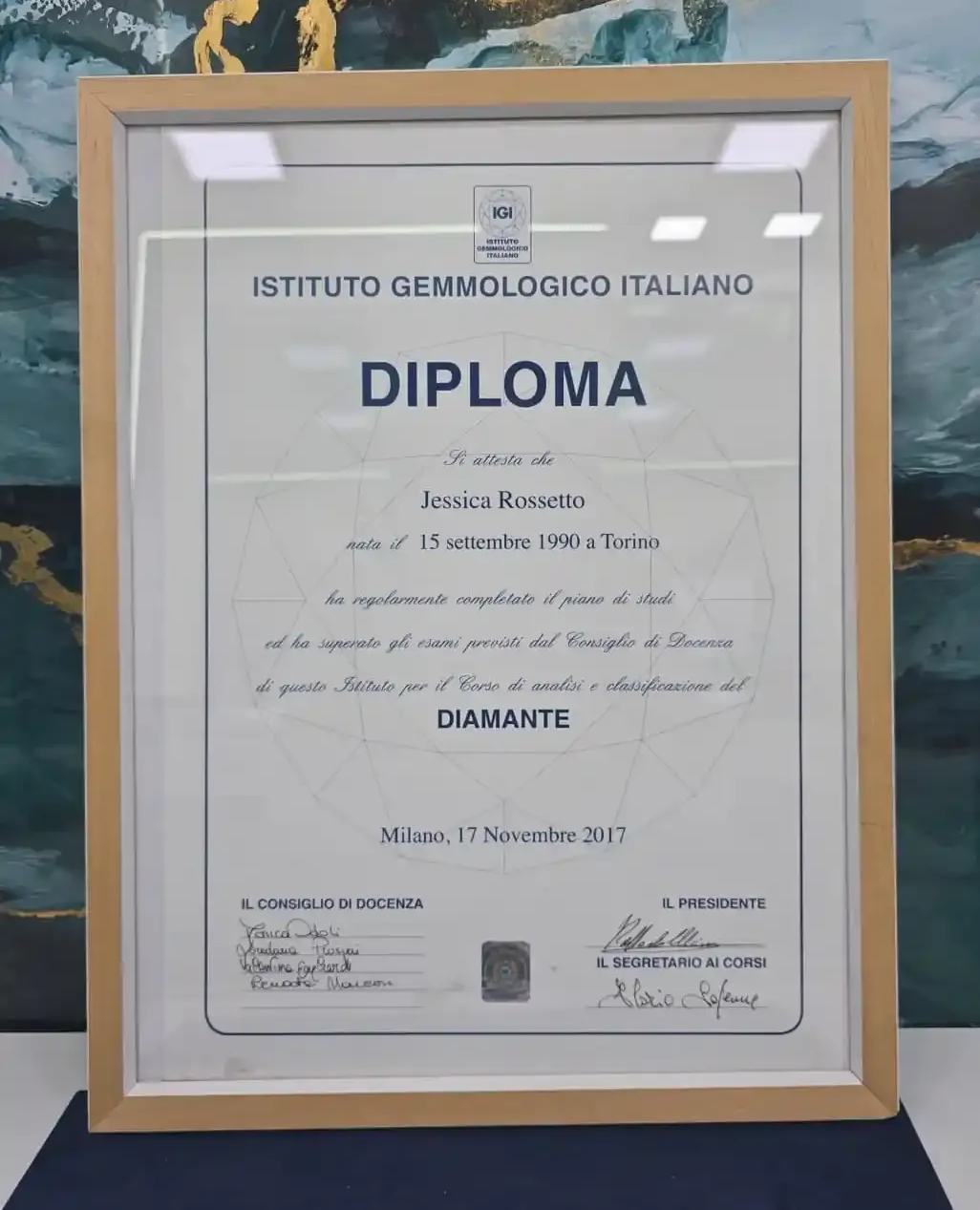 Framed Diploma from Istituto Gemmologico Italiano for diamond certification on a wall