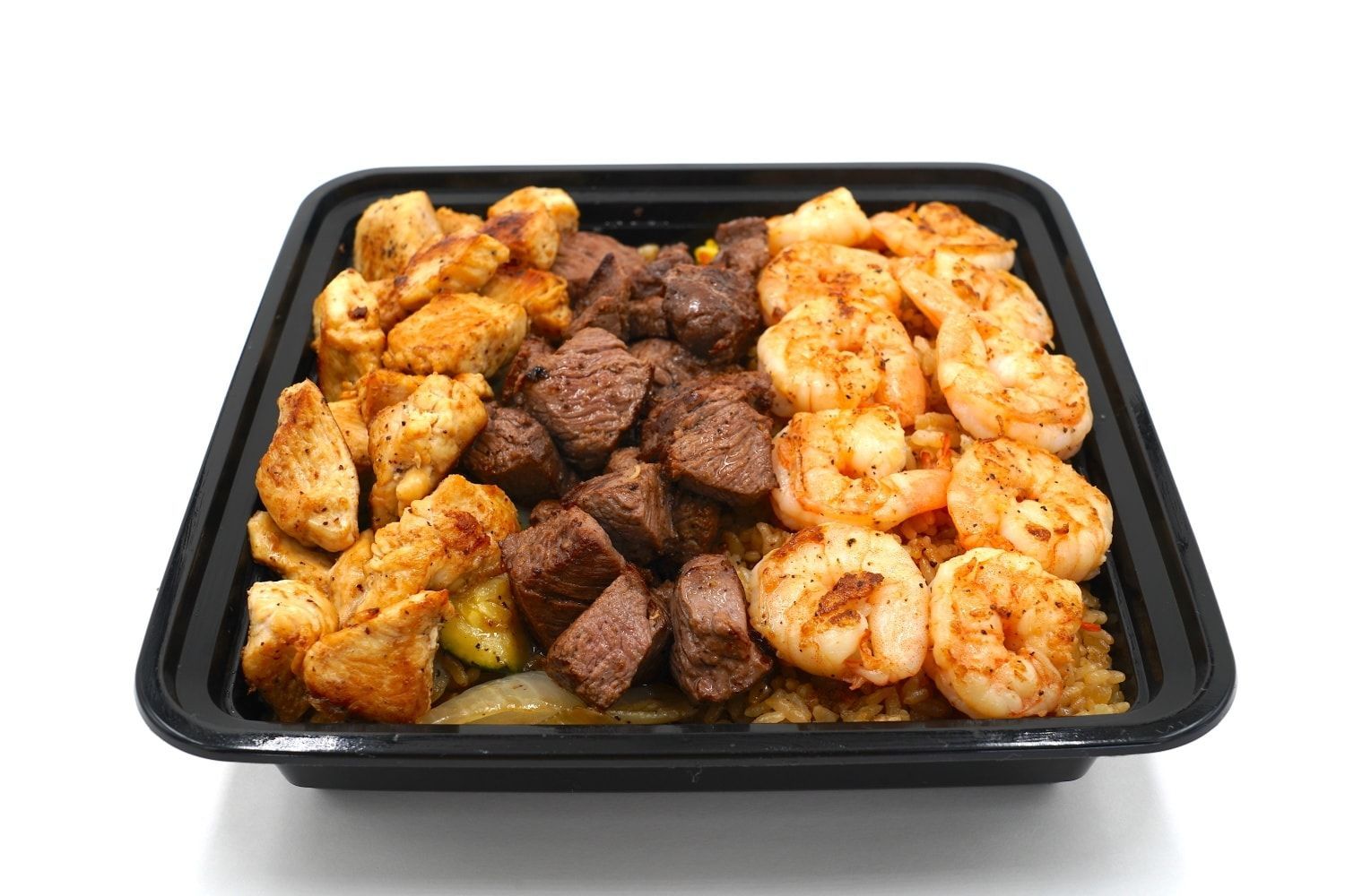 A black container filled with shrimp , steak and rice on a white background.