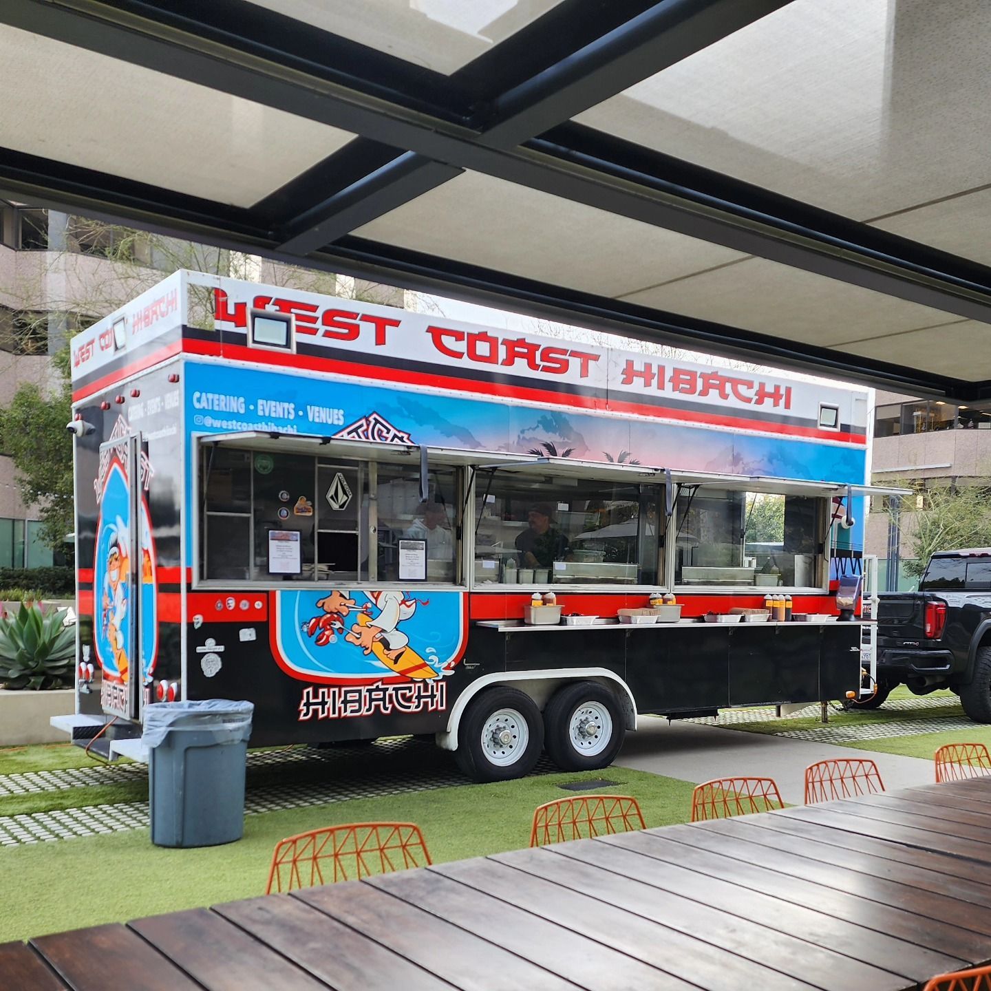 A food truck that says west coast hibachi on it
