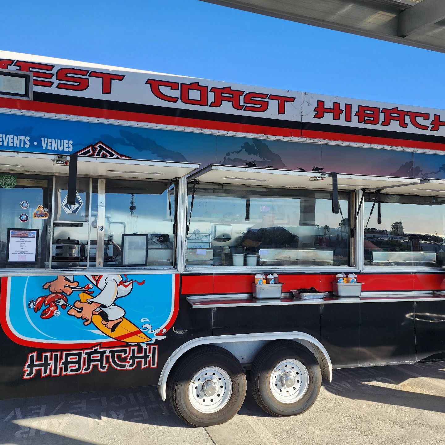 A food truck that says west coast hibach on it