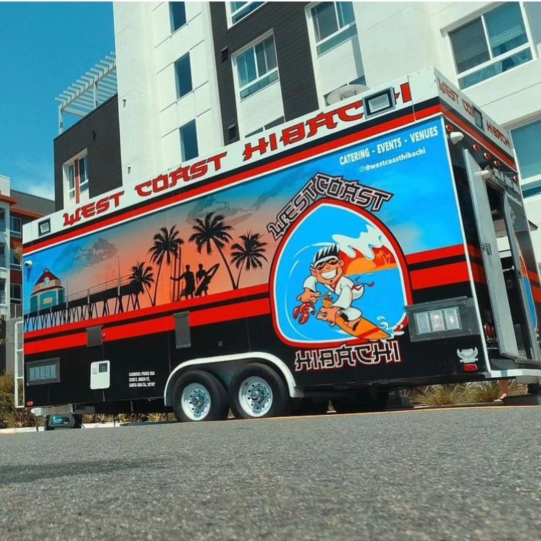 A red and black trailer with the words west coast hibachi on it