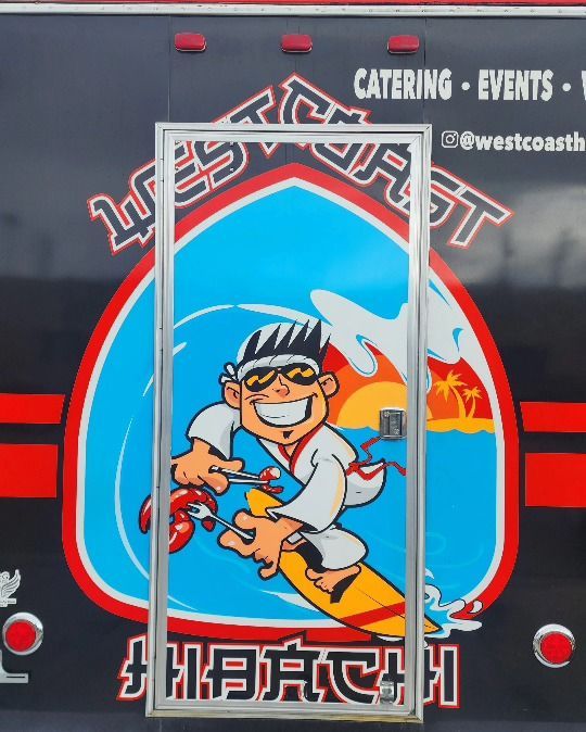 A cartoon of a man on a surfboard is on the side of a catering truck