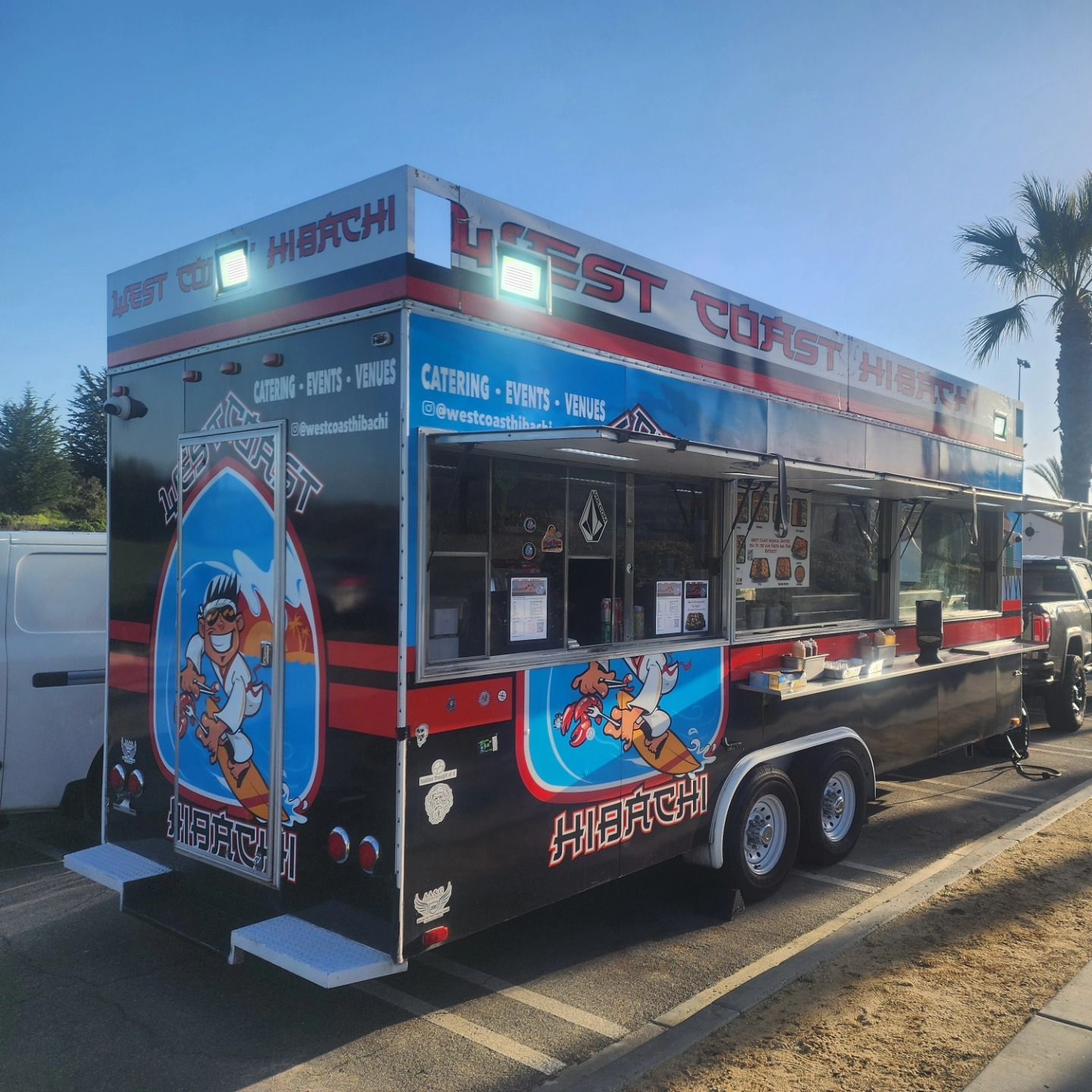 A food truck is parked on the side of the road