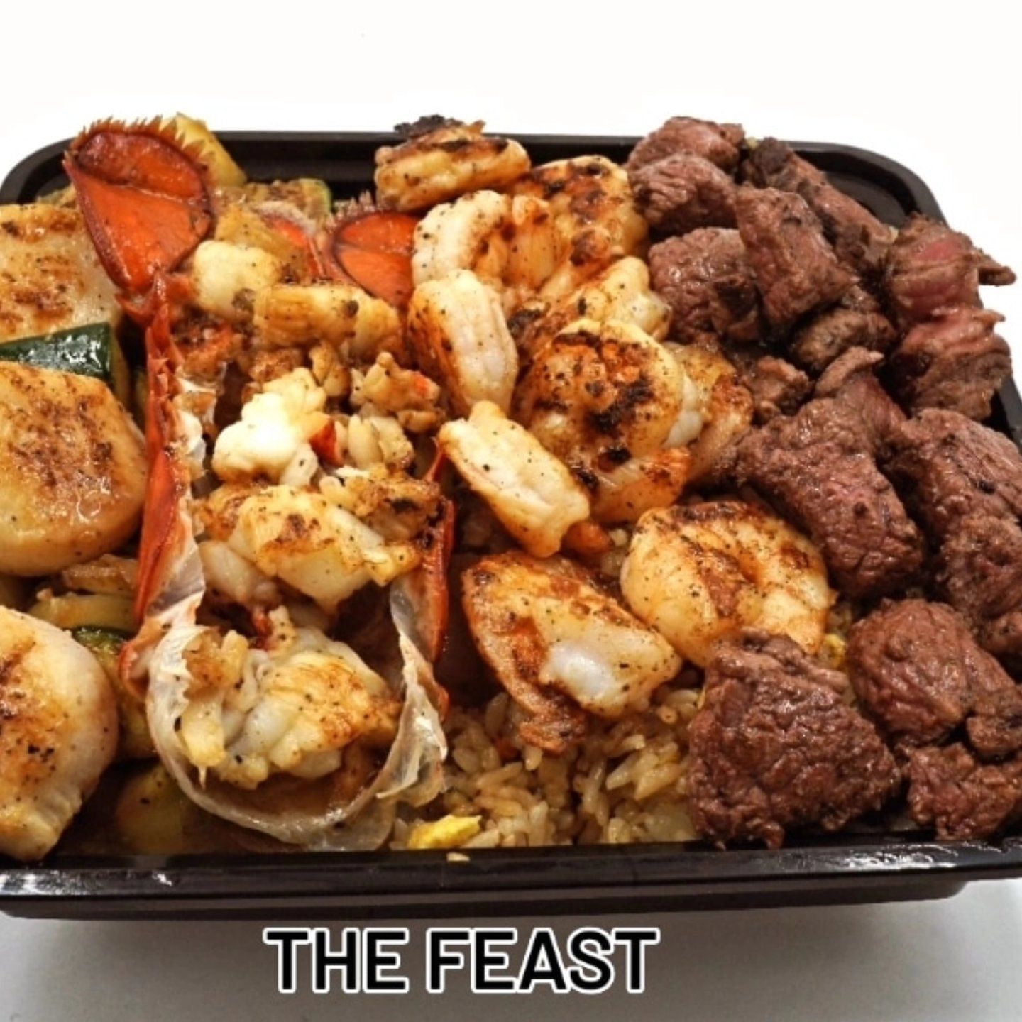 A tray of food that says the feast on it