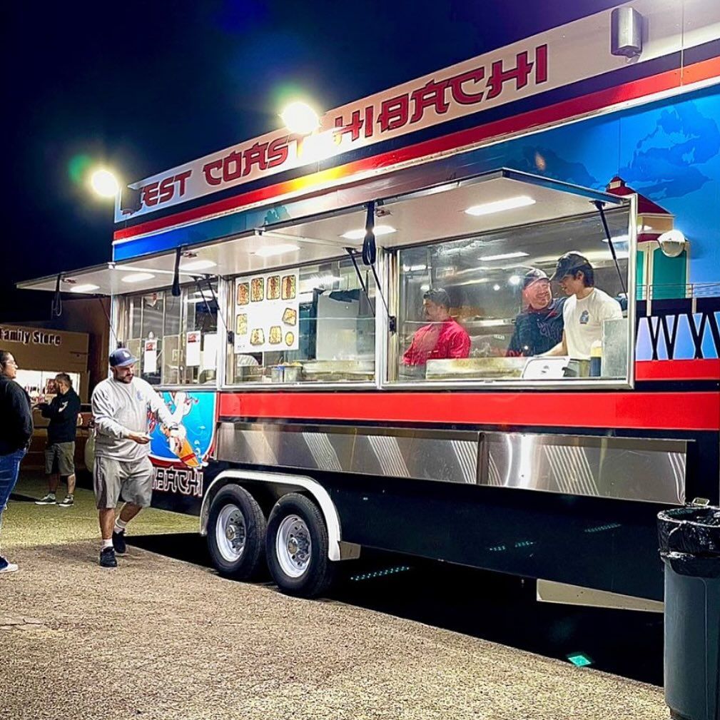 A food truck that says west corn on it