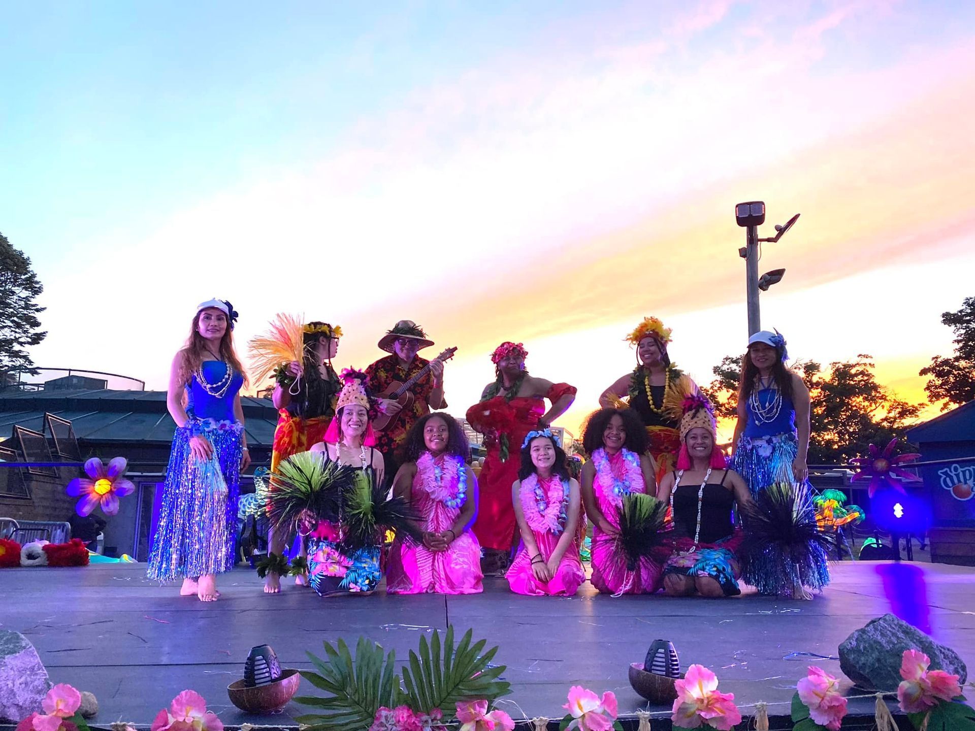 A group of people are posing for a picture on a stage.