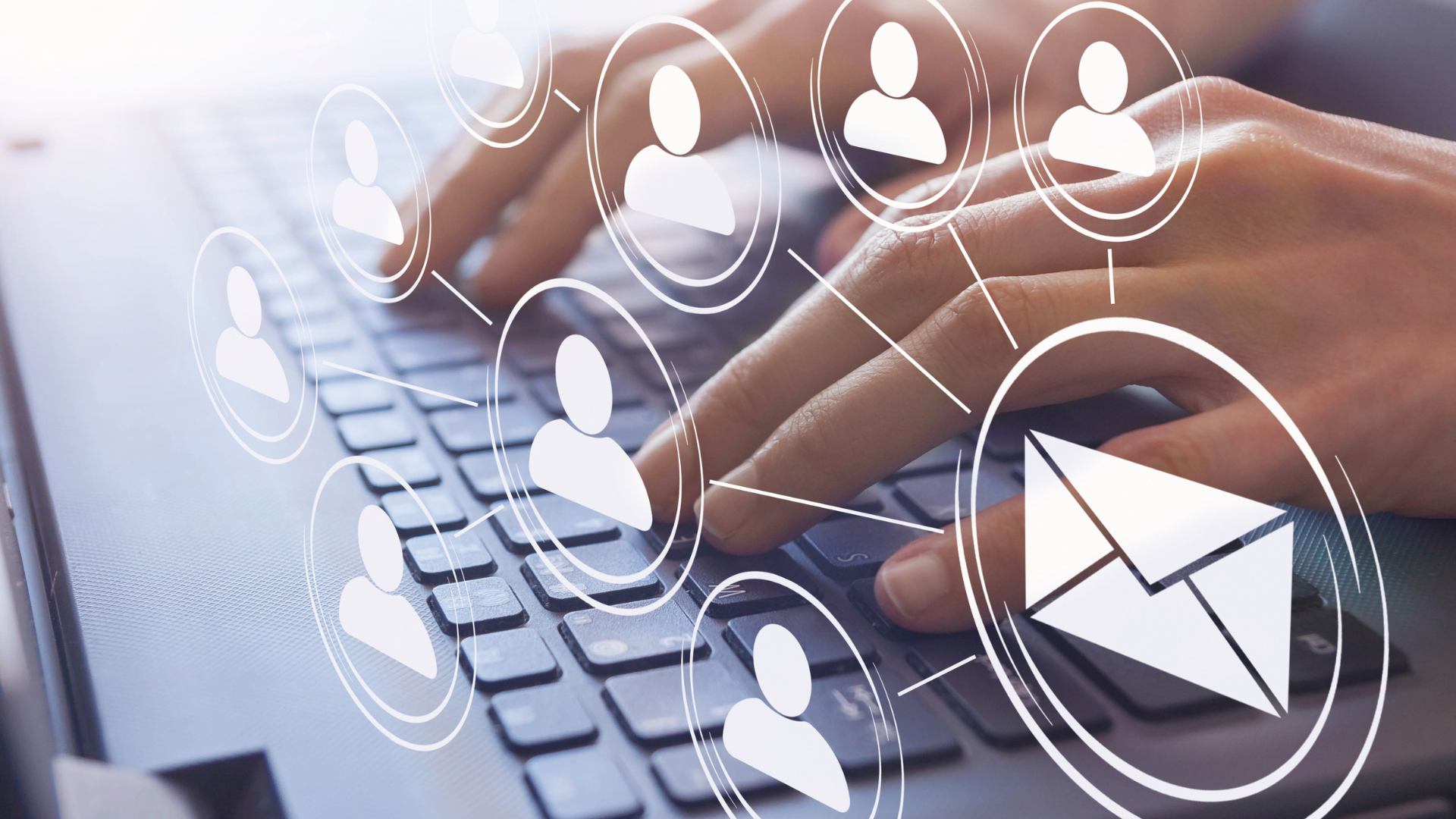Hands typing on laptop with email and social network icons overlay.