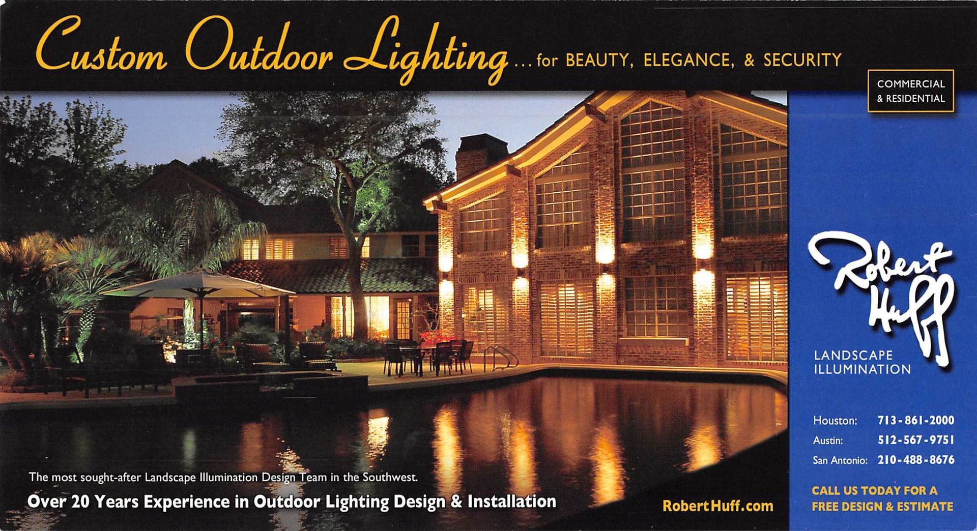 Night-lit luxury home by a lake. Ad for Robert Huff Custom Outdoor Lighting. Brown home with bright lights.