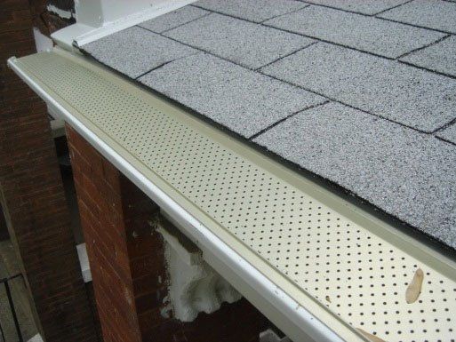 Contractor Adjusting Plastic Gutter Guards — Dover, OH — Wallick's Seamless Spouting LLC
