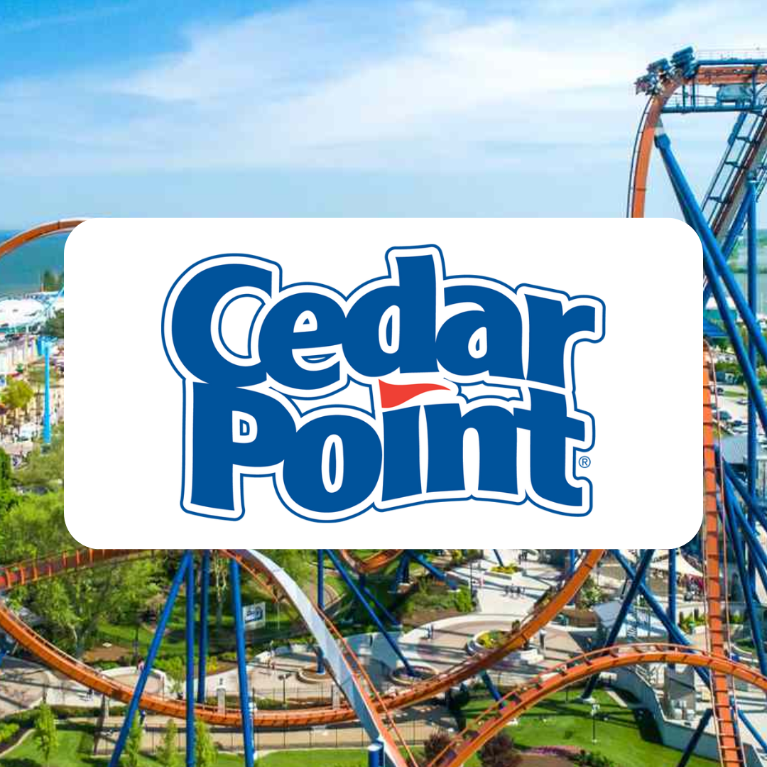 A cedar point logo with a roller coaster in the background