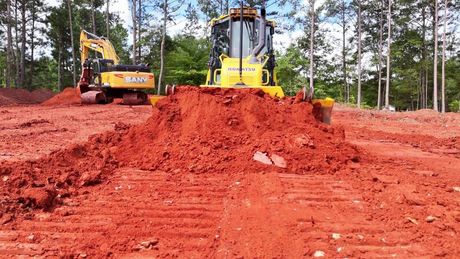 dozer pushing dirt on job site