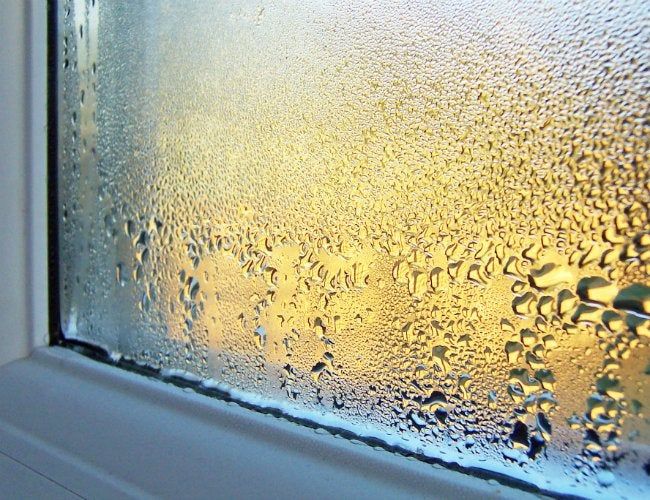 A close up of a window with water drops on it