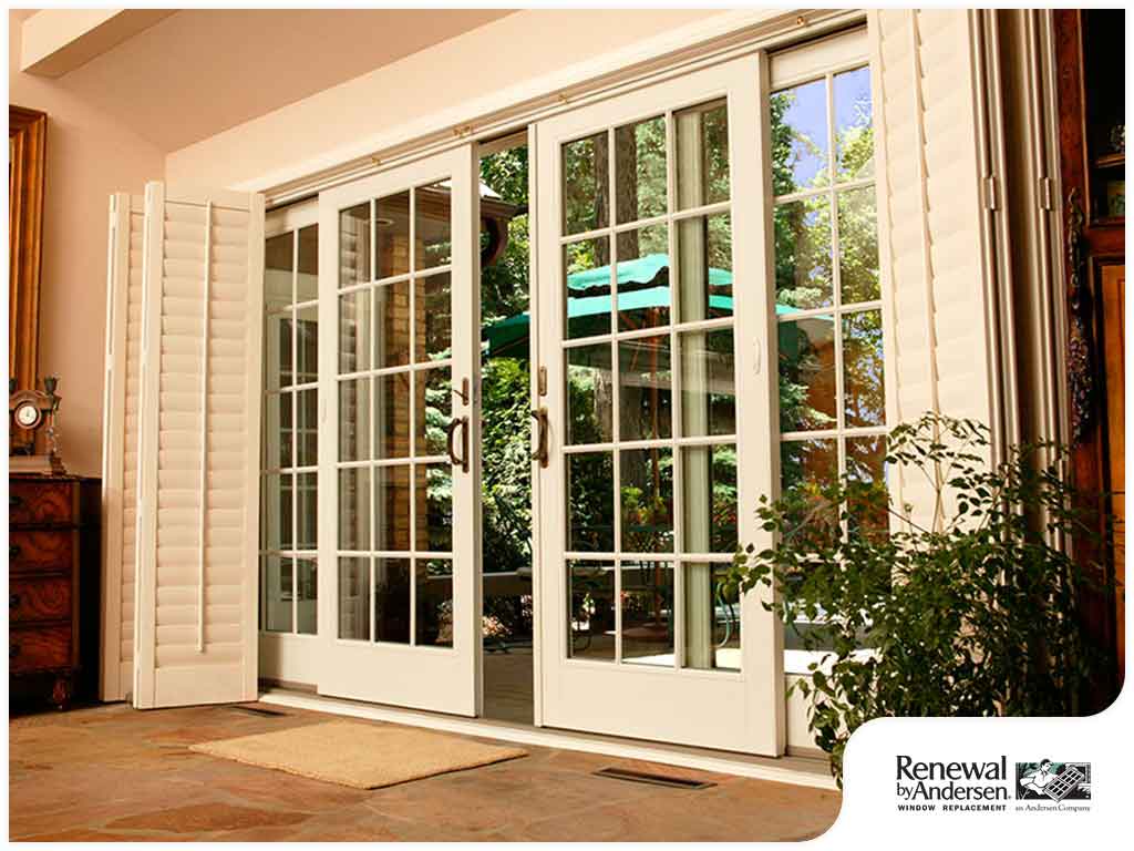 A pair of white sliding glass doors leading to a patio.