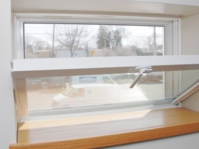 A window with a white frame and a wooden sill