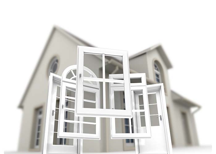 A house with a bunch of windows in front of it.