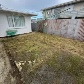 After: Backyard lawn trimmed and tidied around a clothesline in St Kilda, Dunedin.