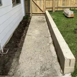 After: Cleaned path and retaining wall after water blasting and garden tidy-up in Bradford, Dunedin.